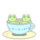 A tiny animated teacup with two cats